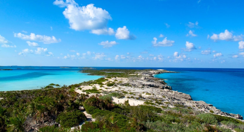 A peninsula stretches outward between two very blue sides of water. 